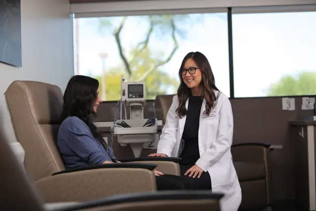 Doctor with patient in chair