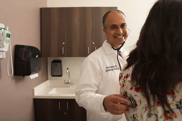Doctor with patient in room